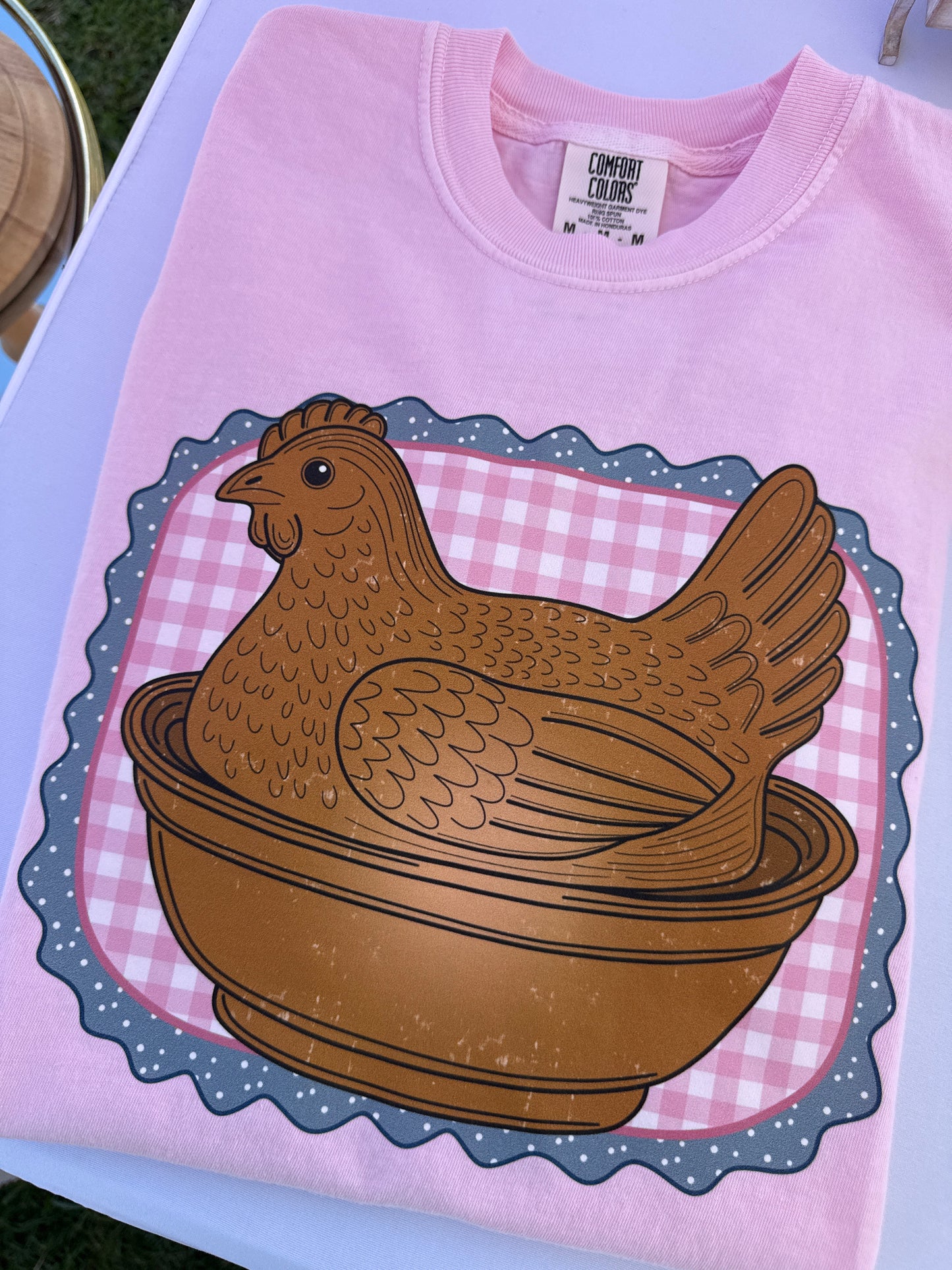 Pink hen on nest