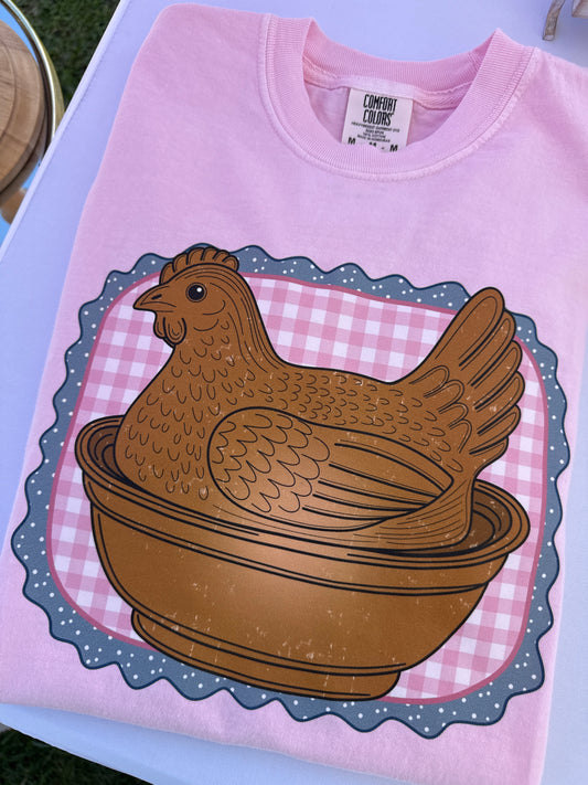 Pink hen on nest